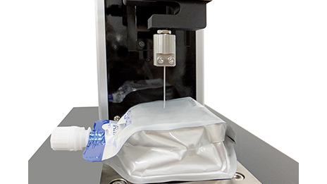 卓上引張圧縮試験機MCTシリーズ 包装容器の突き刺し試験イメージ画像